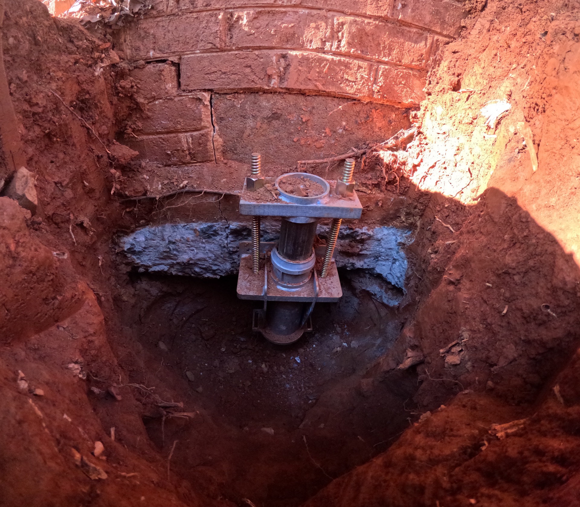 Push pier installation supporting settling foundation with steel support system.